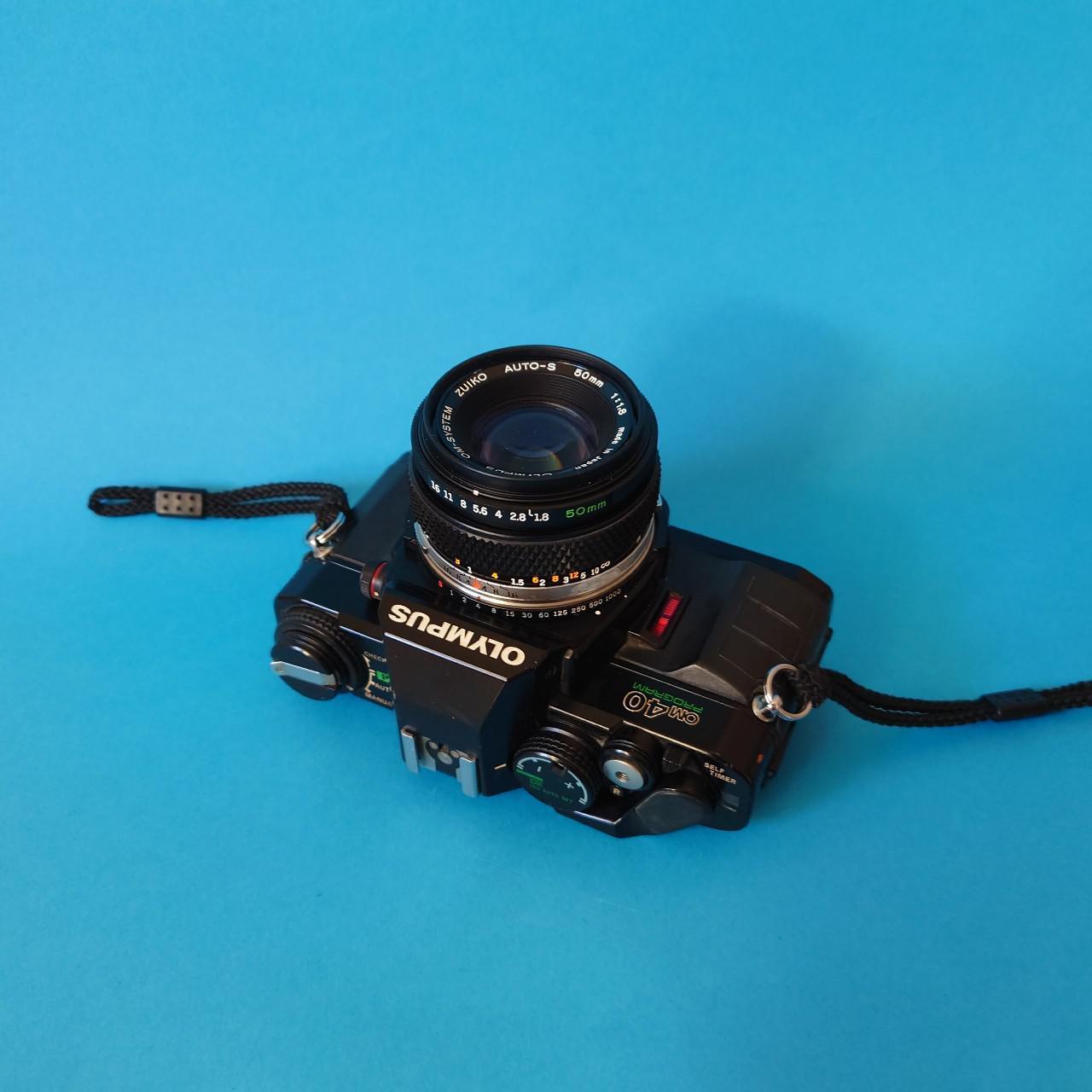 olympus om 40 35mm slr film camera w/ 50mm lens olympus om 40 35mm slr film camera w/ 50mm lens